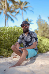 The Beard Baron seated on Kailua Beach