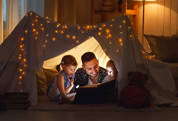 happy family father and children reading a book - Roll Up Baby