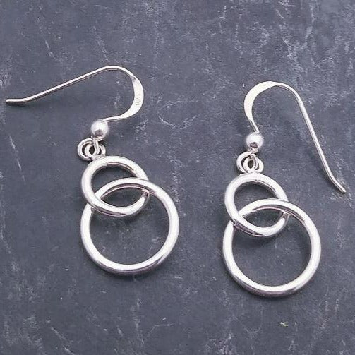 sterling silver drop earrings with two intertwined circles on a french wire