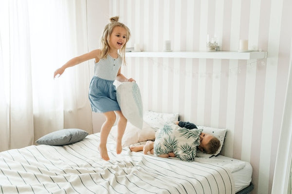 Girl Jumping on the Bed