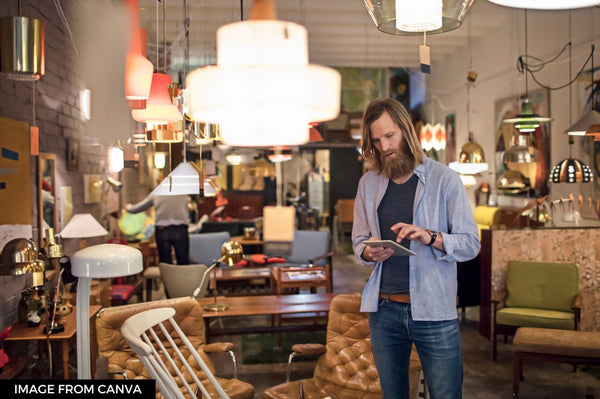 Man standing in furniture shop