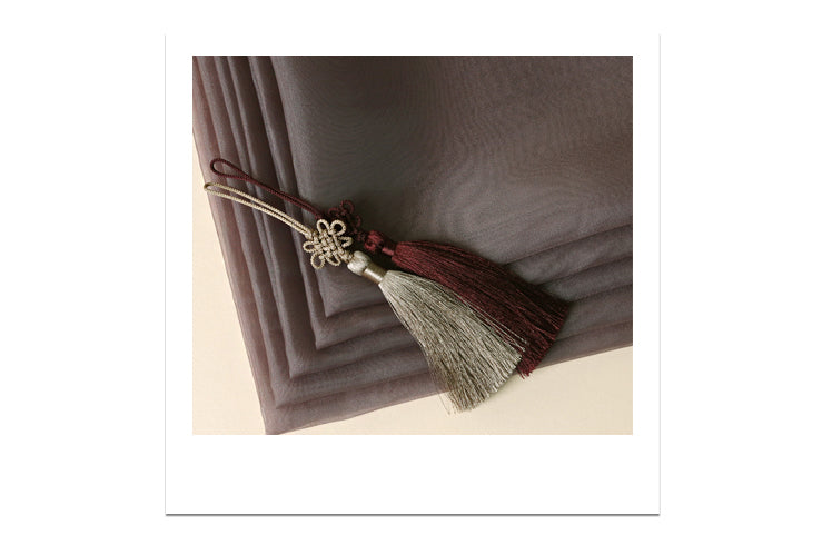 You can see the tassel that adorns the edge of this wrapping cloth to add a decorative touch to the fabric.