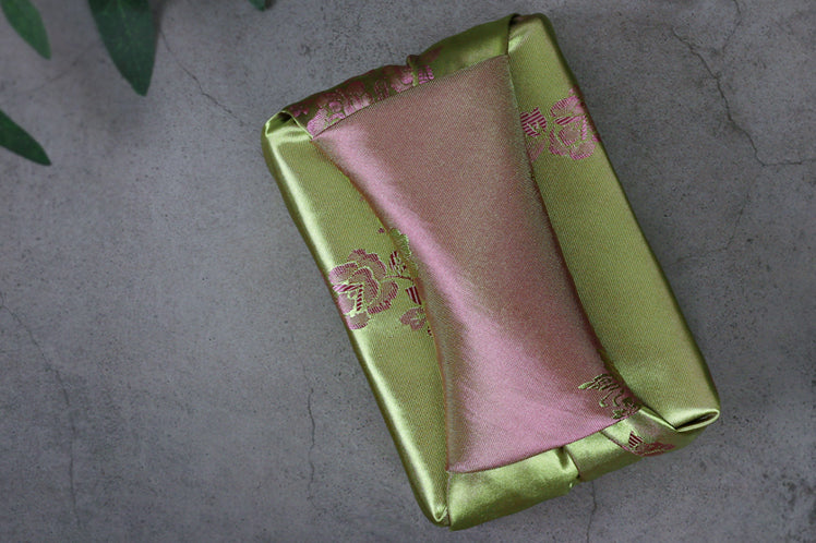 The wine and jade floral double sided Korean wrapping cloth is graceful and playful for any traditional Korean event.