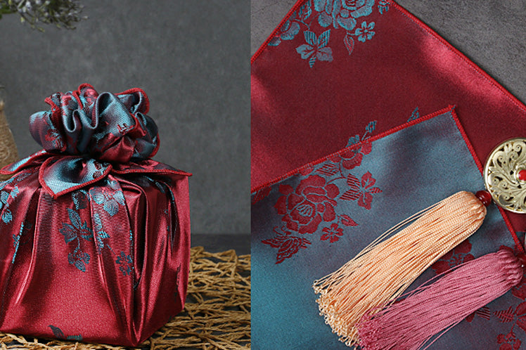 What's great about wrapping presents with fabric is that you can wrap almost any gift with it easily. We offer so many different sizes of Korean Bojagi wrapping paper that you'll find the right one to dress up your holiday and add decadence to any occasion, like with this brick red and sea color.