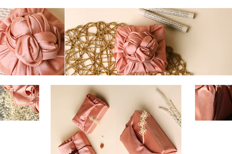 To add a spiffy decoration on the pink gift wrapping cloth, make a bow or knot at the top.