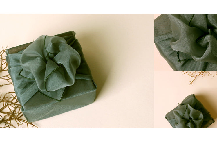 A bow accentuates the jade Bojagi art Korean wrapping cloth and adds some radiance to your gift.