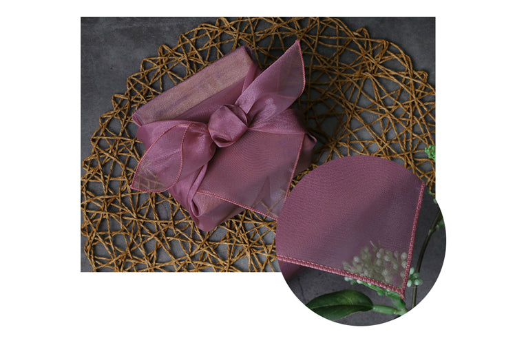 The eye-catching bow at the top of this plum fabric gift wrap makes it idyllic for a Doljanchi.