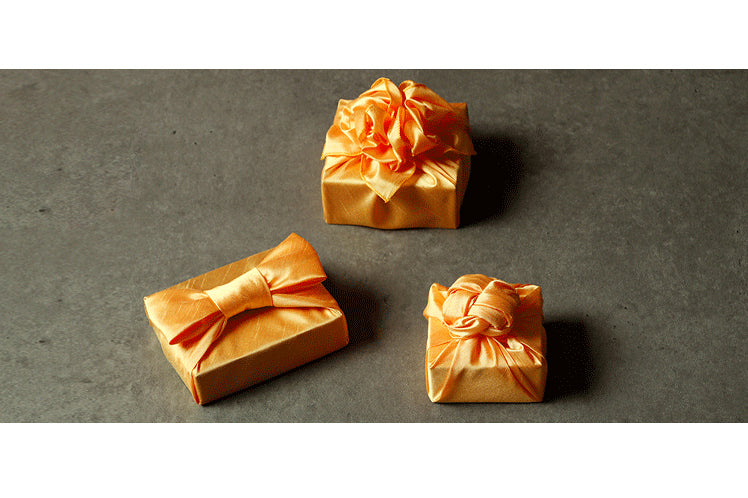 Korean Bojagi for sale comes in many colors, such as this tangerine colored luxury gift wrap.