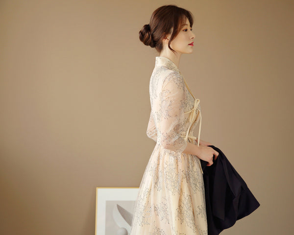 This is a beautiful modern hanbok in beige that is used for weddings.