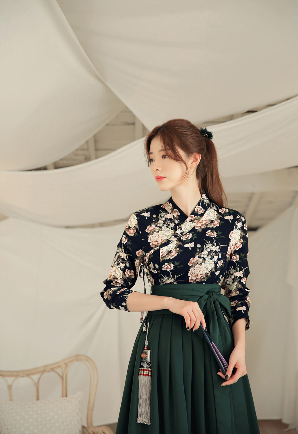 Bring a touch of Korea with you by wearing this cyan flower modern hanbok dress.