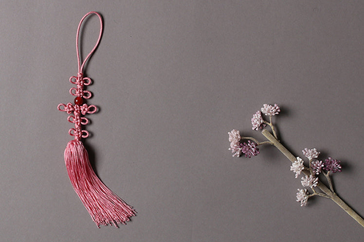 A beaded ribbon tassel is ideal for festive occasions and it's a great way to decorate your normal look.