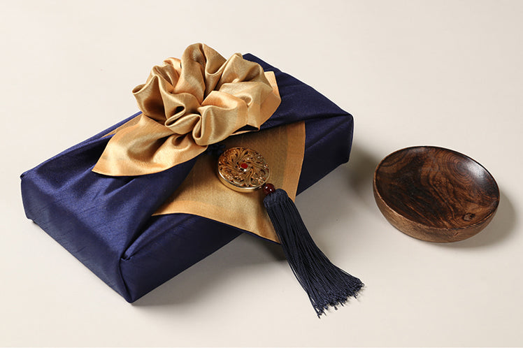 A black Circle Arabesque Norigae look simply stunning around a Bojagi gift wrap.