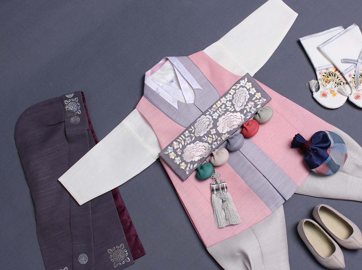 This image shows the stunning look of the Classy Prince Baby Boy Hanbok in roseate.