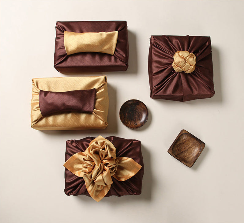 Wrapping presents with fabric brings a captivating look to any formal event.