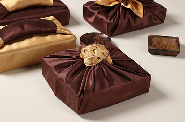 Camel and saddle colored Bojagi Korean wrapping cloth adds a tactful ending to any gift.