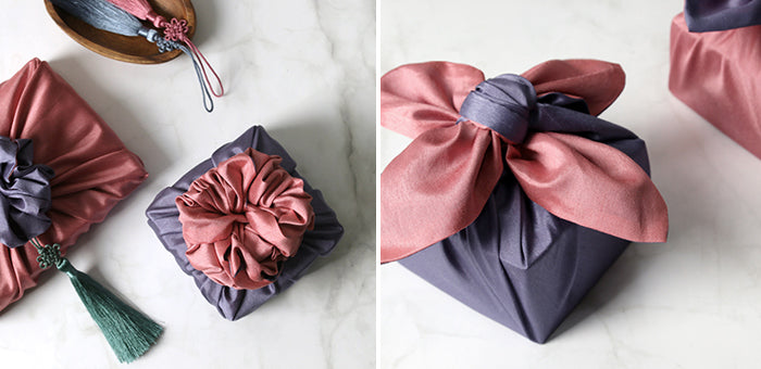 Wrapping presents with fabric, such as this periwinkle and rouge Korean Bojagi, injects charm.