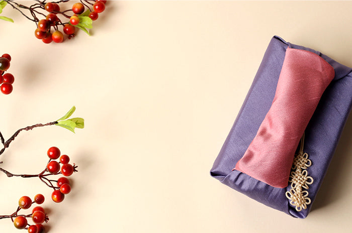 Whether it's Christmas or a Harvest Festival, this amethyst and salmon fabric wrapping paper is a sublime choice of Bojagi gift wrap.