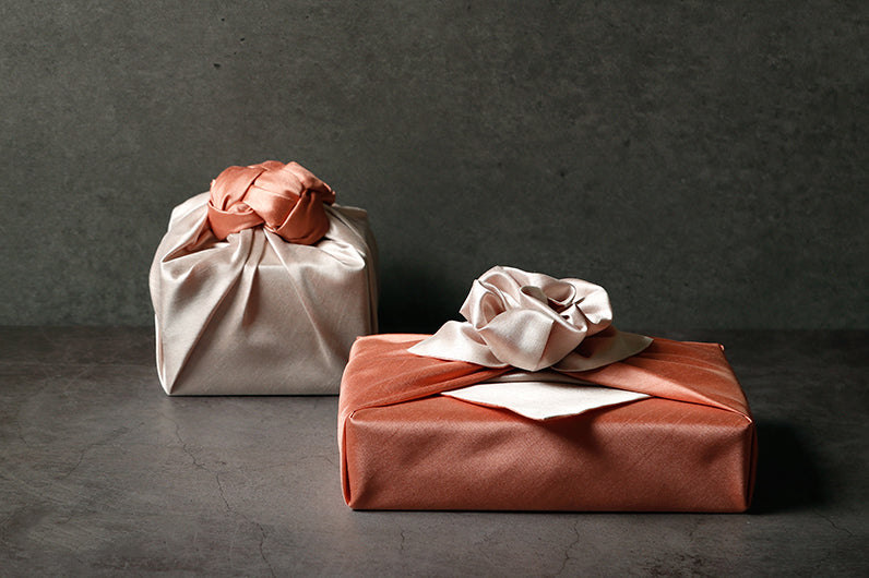 Beautiful bows at the point of the present make the titian and khaki Bojagi fabric wrapping paper a classic for any Korean formal or informal event.