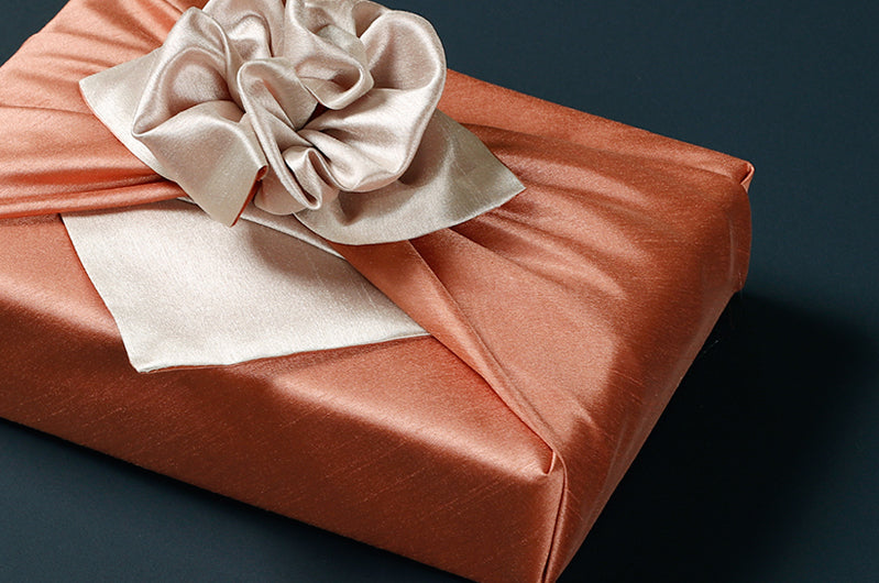 Tangerine and taupe double sided Korean fabric wrapping are stellar for any celebration or ceremony.