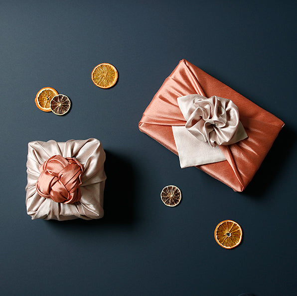 Add a colorful element to your gifts with this apricot and oatmeal fabric gift wrap.