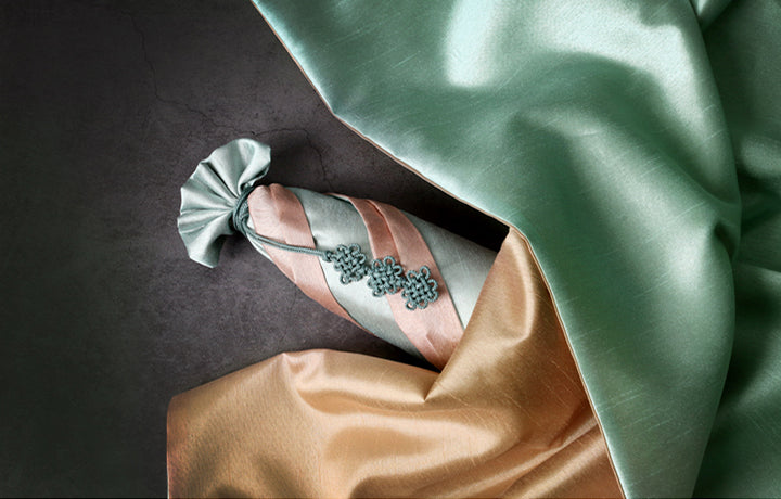 Wrapping presents with fabric is super easy using the Korean Bojagi and this beige and teal is a wonderful example.