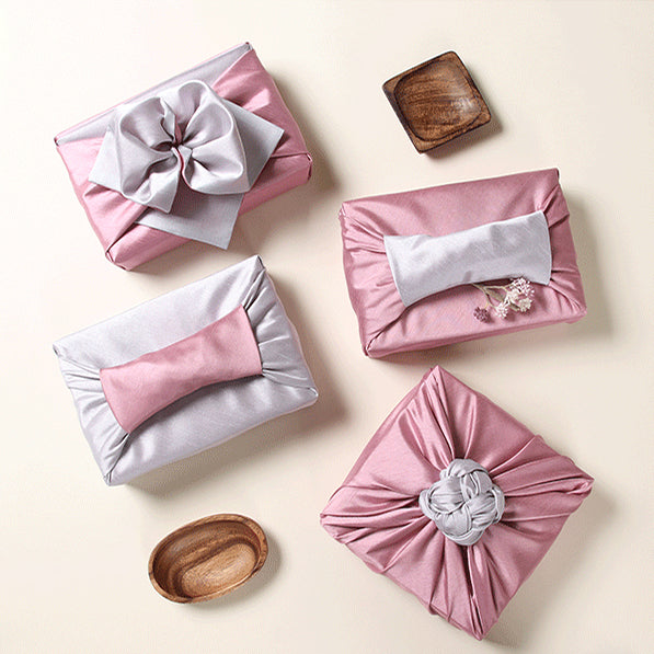 The rosy and slate colors look dreamy and this luxury gift wrap comes in multiple sizes.