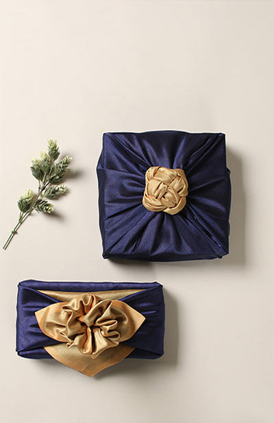 Add a bow to the top of the saxe blue and ivory Korean Bojagi gift wrapping cloth for a phenomenal ending to the gift.