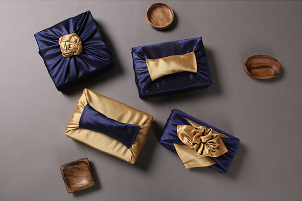 Wrapping presents with fabric is a blast if you're using the Bojagi art in dark blue and caramel.