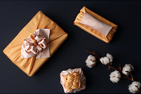 The one thing any party needs is a gift wrapped in this titian and straw gift wrapping cloth for maximum decadence.