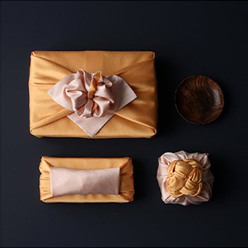 We offer multiple sizes of Bojagi Korean wrapping for sale, such as this apricot and flaxen color, to fit any size or shaped gift.