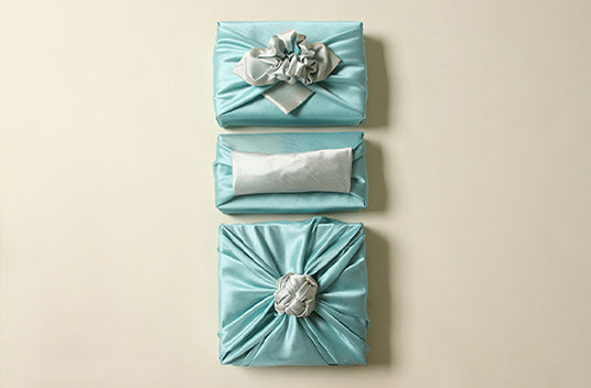 Azure and silver come together to create a fantastic look if you want to wrap presents with fabric cloth to make your present unique.