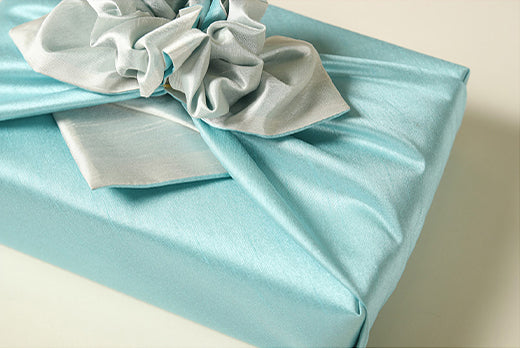 An up close look at the aquamarine and ash colored Korean Bojagi. Any man or woman would be thrilled to get a gift wrapped in this reusable gift wrap.