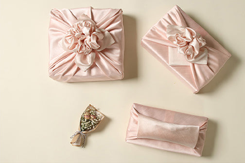 This fuchsia and light peach Korean gift wrapping cloth is ideal for spring birthdays and weddings. It's reusable gift wrapping that allows you to reverse the colors to fit the joyous event.