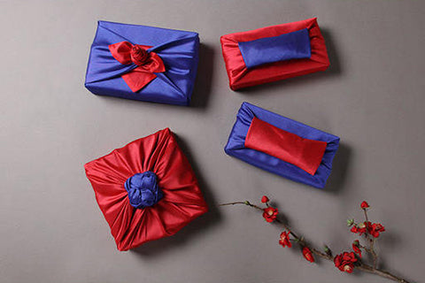 Shower someone special with love by giving them a gift with this fabric wrapping cloth in deep rose and neon blue.