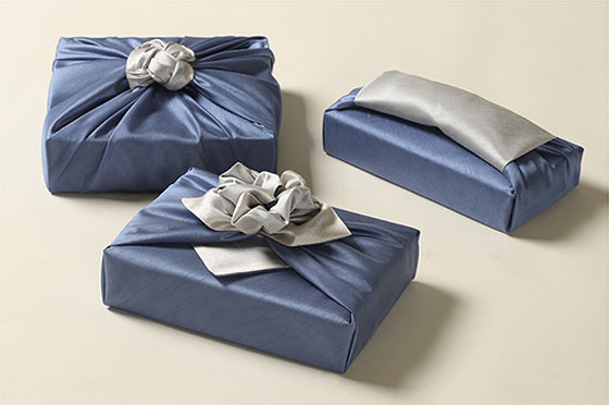 Take their breath away when you hand them a gift with this sapphire and peppery gift wrapping cloth.