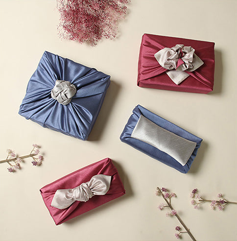 A heartfelt and personal way to make anyone smile is by wrapping a gift in this luxurious blue-gray Bojagi fabric.