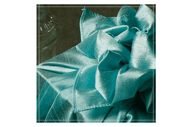 Put a bow or knot in the light cyan Korean fabric cloth to add an uplifting and ornate design.