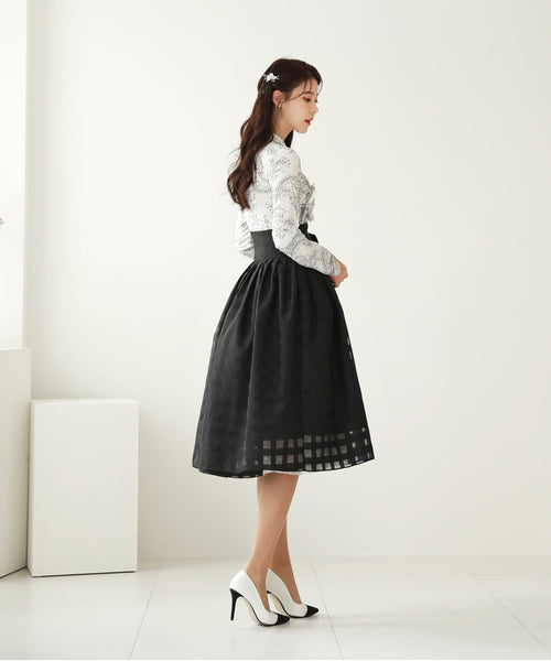 This attention getting light-cream and deep ebony floral modern hanbok dress will make you feel like a superstar.