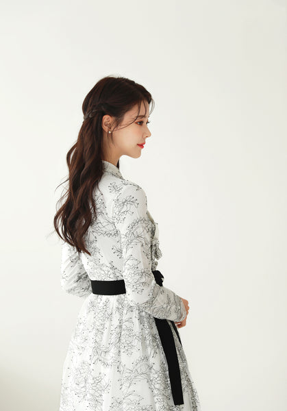 The intricate flower details on this beige and midnight floral modern hanbok dress are impressive and made with love.