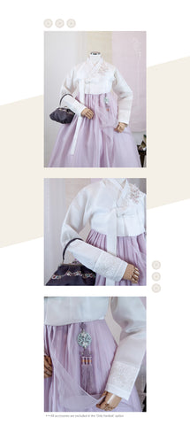 Introducing our exquisite hanbok, a perfect combination of sophistication and charm. The jeogori, made from silky ivory fabric, showcases intricate small flowers delicately embroidered with silver thread, exuding an aura of grace and beauty.