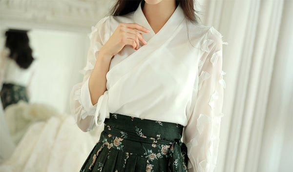 Impress everyone you see with this ivory butterfly modern hanbok blouse.