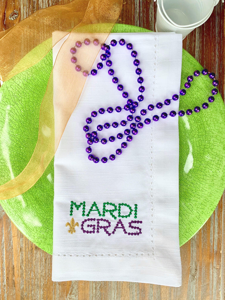 https://cdn.shopify.com/s/files/1/0393/1893/products/bead-mardi-gras-napkins-set-of-4-napkins-white-tulip-embroidery-1_1024x1024.jpg?v=1676307574