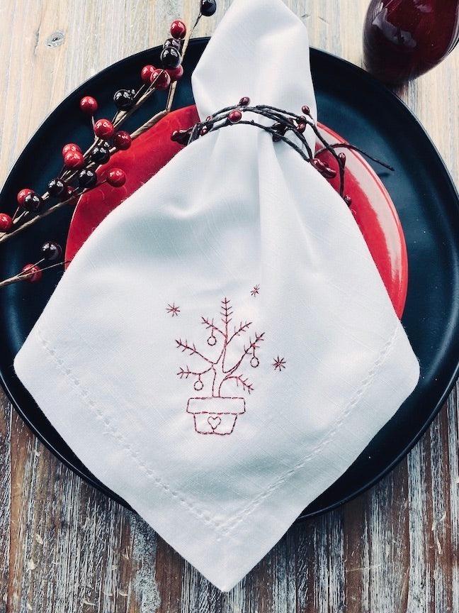 https://cdn.shopify.com/s/files/1/0393/1893/products/christmas-tree-embroidered-cloth-napkins-set-of-4-napkins-white-tulip-embroidery-2_136d7cf0-6447-4787-a26a-c8da4b139839_1024x1024.jpg?v=1676312292