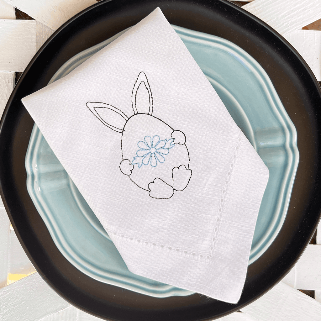 https://cdn.shopify.com/s/files/1/0393/1893/products/easter-bunny-egg-embroidered-cloth-napkins-set-of-4-white-tulip-embroidery-1_1024x1024.png?v=1676314645