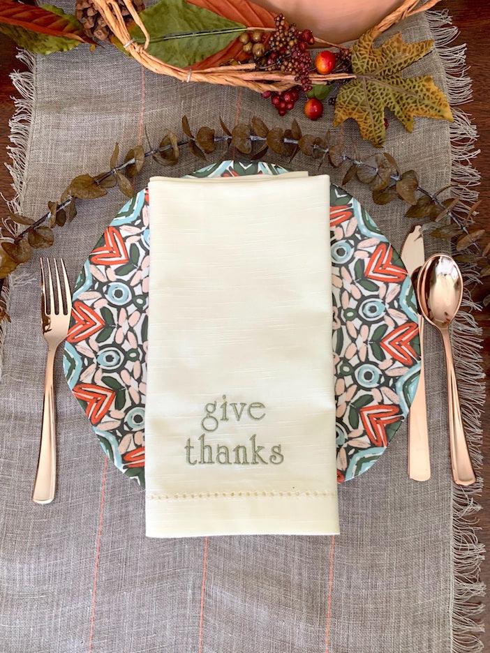 https://cdn.shopify.com/s/files/1/0393/1893/products/thanksgiving-give-thanks-embroidered-cloth-dinner-napkins-set-of-4-napkins-white-tulip-embroidery-2_1024x1024.jpg?v=1676306647