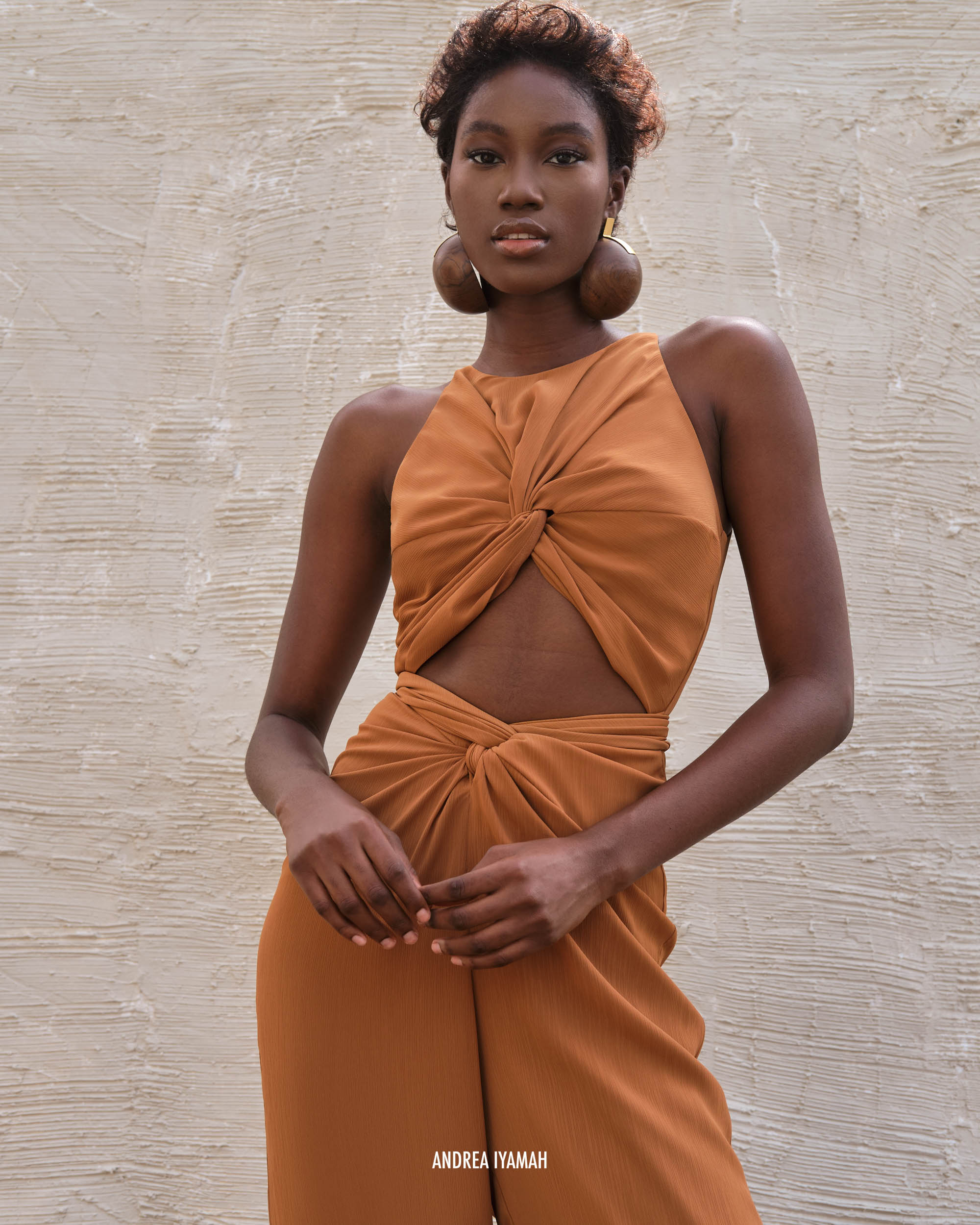 The AMINATA jumpsuit is a best-seller for many reasons.  It features our signature keyhole waist and tie sash that beautifully drapes around the feminine figure. The AMINATA jumpsuit is designed in a signature textured chiffon that is lightweight and flows freely from day to night.