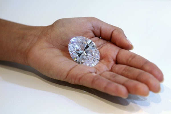 118 carat oval diamond in hand 