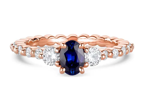 Oval shaped blue sapphire and diamond engagement ring