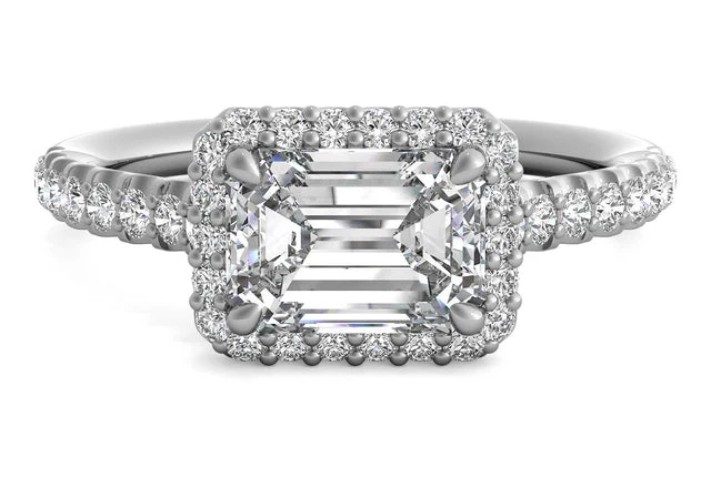 East-West set Emerald cut engagement ring