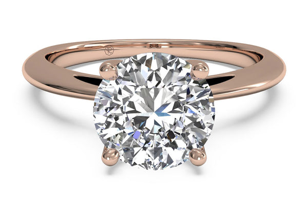rose gold solitaire engagement ring with a round cut diamond